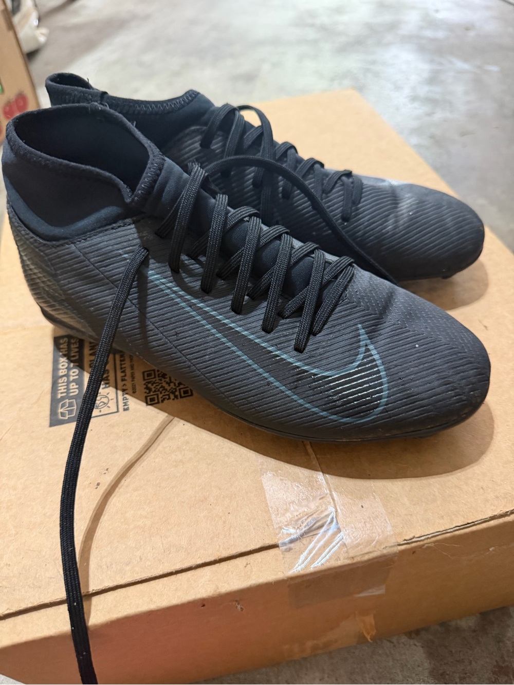 Nike Black Soccer Cleats with Teal Swoosh